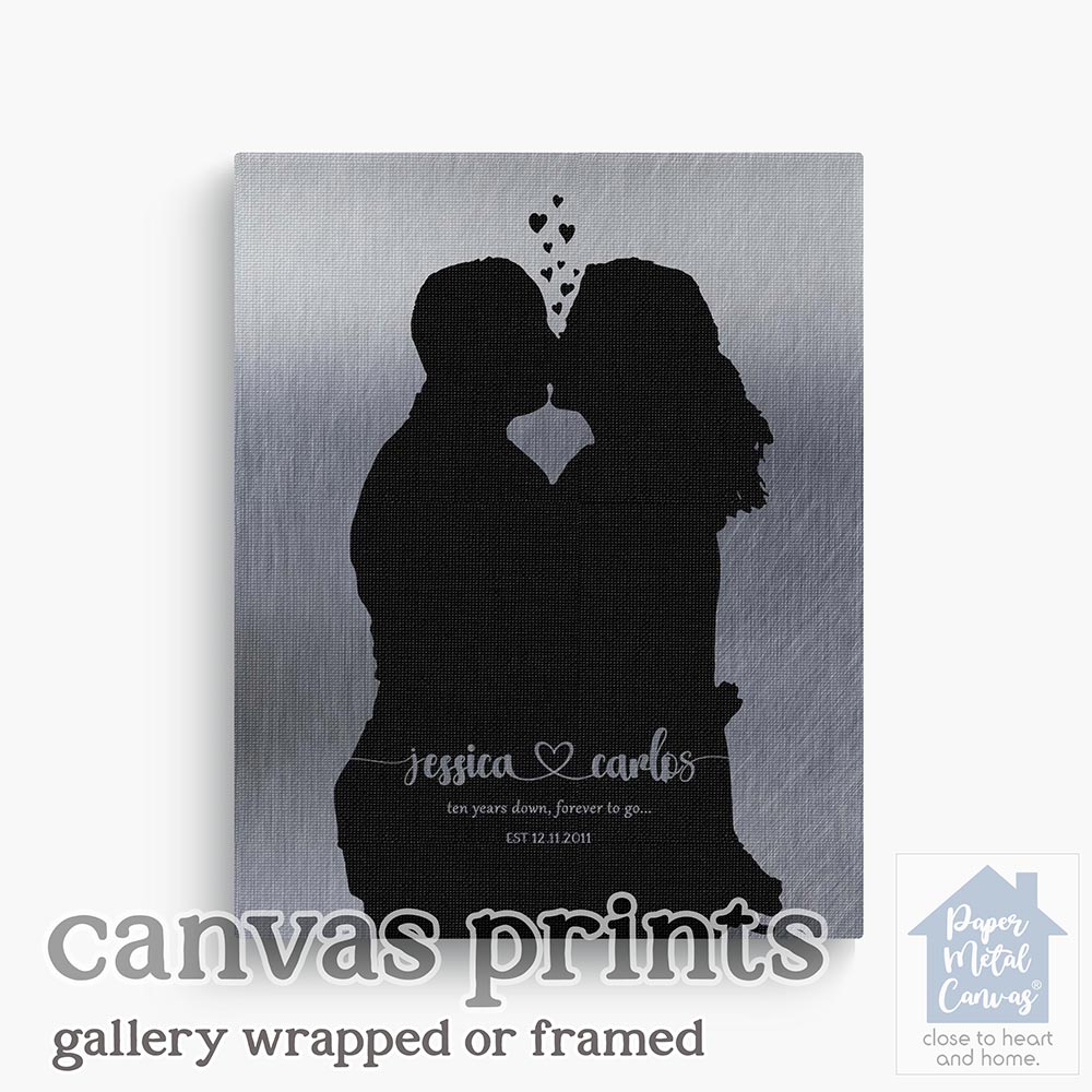 Relocation concept. A smiling cheerful multiracial couple in embraces lookin in each other eyes Relocation concept. A smiling cheerful multiracial couple in embraces lookin in each other eyes