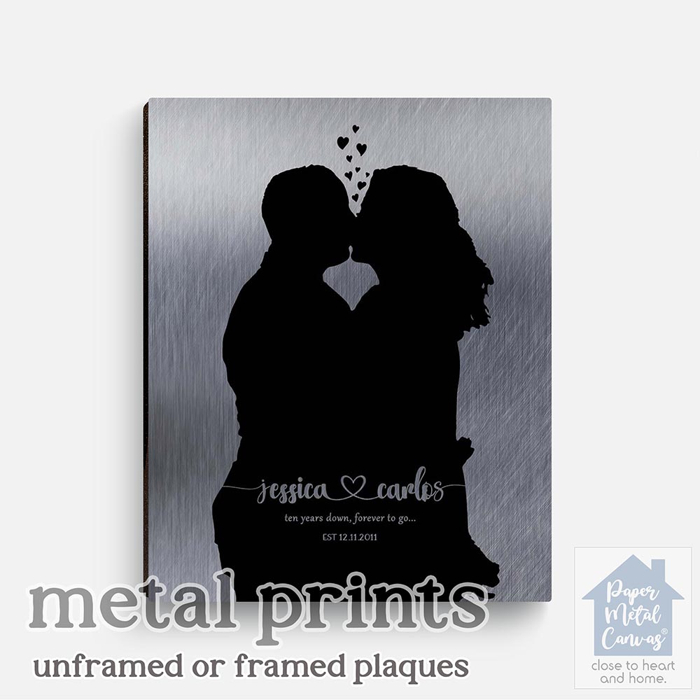 Relocation concept. A smiling cheerful multiracial couple in embraces lookin in each other eyes Relocation concept. A smiling cheerful multiracial couple in embraces lookin in each other eyes