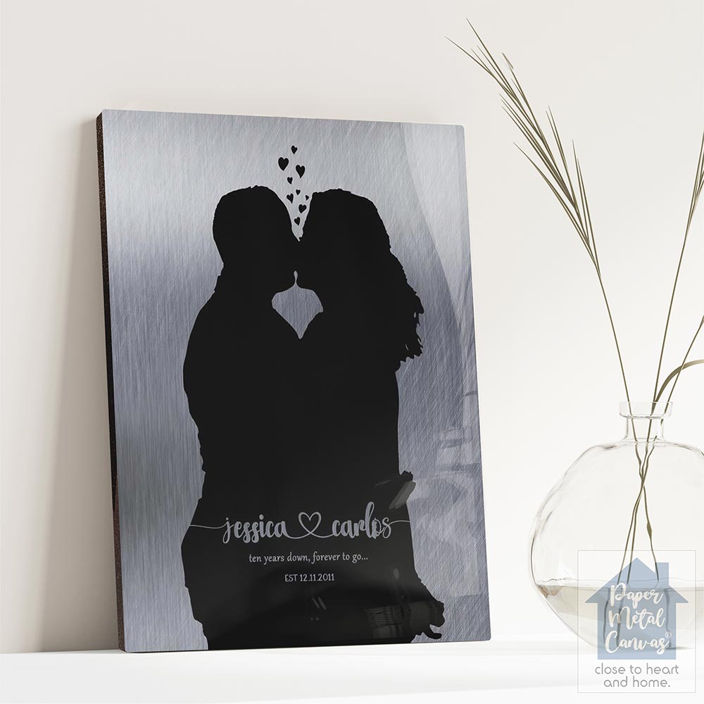 Relocation concept. A smiling cheerful multiracial couple in embraces lookin in each other eyes Relocation concept. A smiling cheerful multiracial couple in embraces lookin in each other eyes