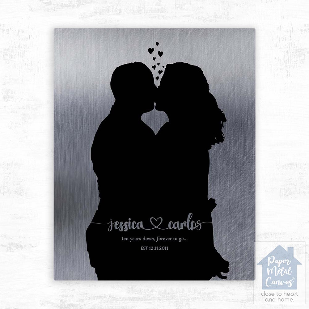 Relocation concept. A smiling cheerful multiracial couple in embraces lookin in each other eyes