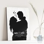 Relocation concept. A smiling cheerful multiracial couple in embraces lookin in each other eyes