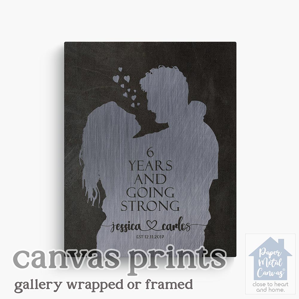 Relocation concept. A smiling cheerful multiracial couple in embraces lookin in each other eyes Relocation concept. A smiling cheerful multiracial couple in embraces lookin in each other eyes