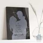 Relocation concept. A smiling cheerful multiracial couple in embraces lookin in each other eyes