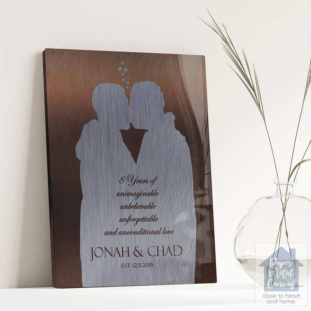 Relocation concept. A smiling cheerful multiracial couple in embraces lookin in each other eyes Relocation concept. A smiling cheerful multiracial couple in embraces lookin in each other eyes